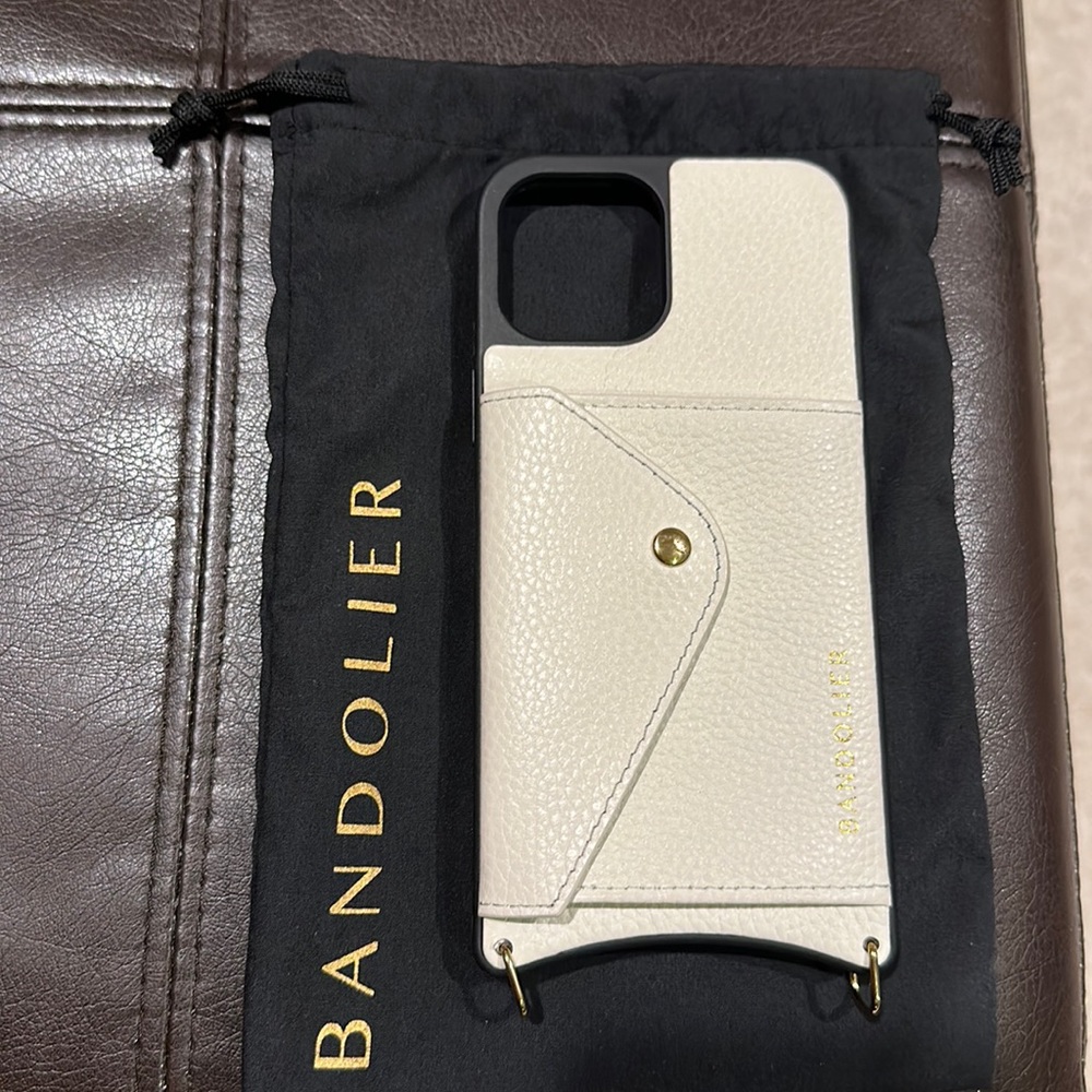 Bandolier iPhone 12 Pro Max case with matching strap and storage bag.